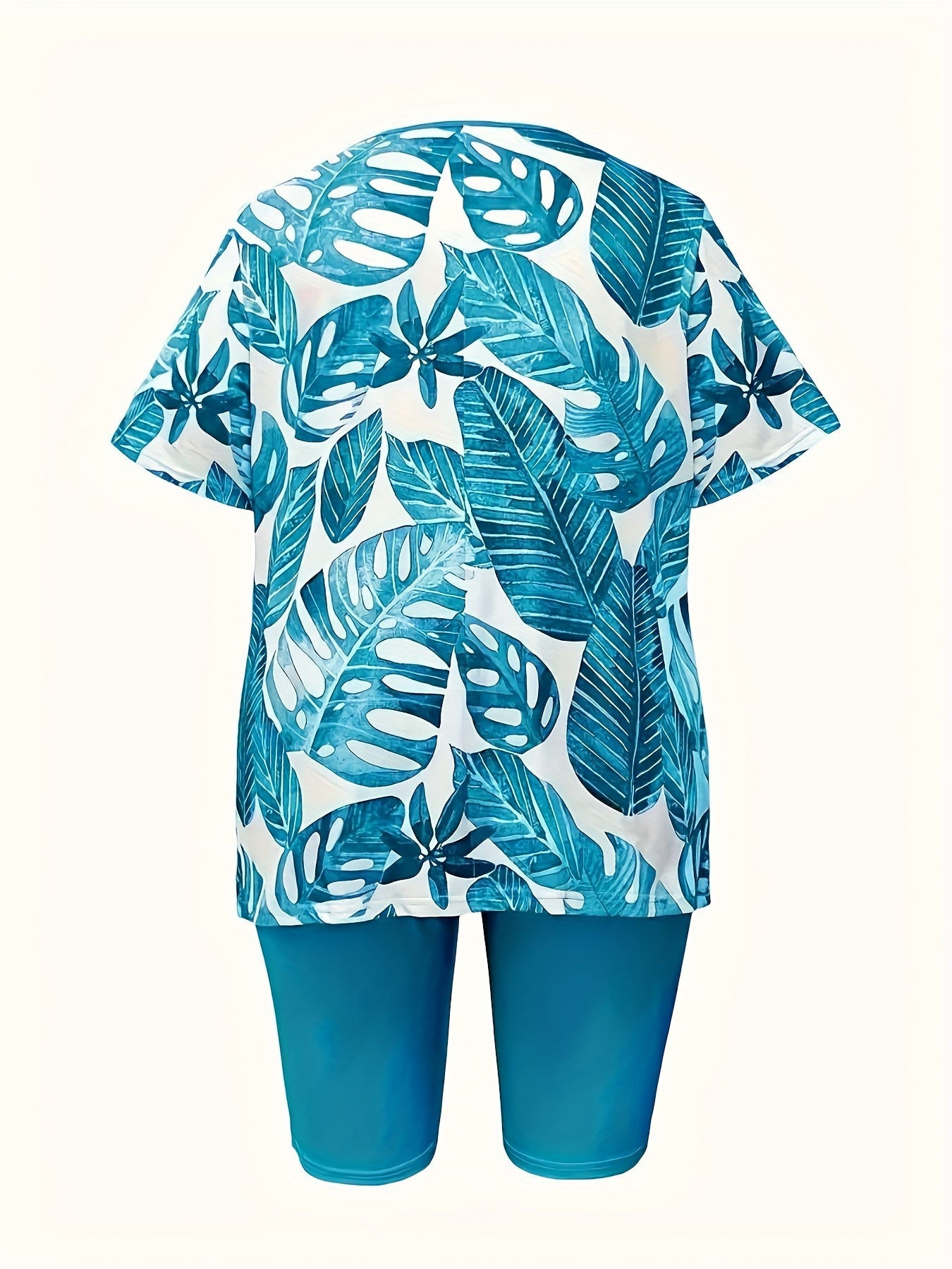 A Two-Piece Set Featuring a Printed Top with a Casual Round Neck And Short Sleeves, Paired with Shorts, Designed for Women.